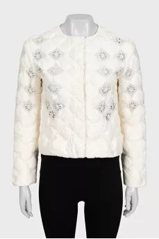 Straight jacket decorated with perforations