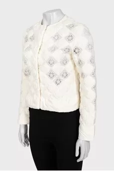 Straight jacket decorated with perforations