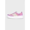 Purple sneakers with a signature print