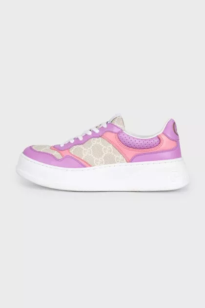 Purple sneakers with a signature print