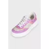 Purple sneakers with a signature print