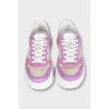 Purple sneakers with a signature print