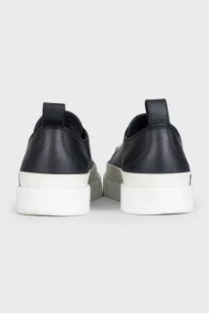 Black leather sneakers with a signature logo