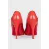 Red leather high-heeled shoes