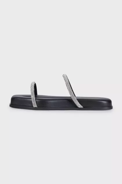 Leather flip-flops decorated with rhinestones