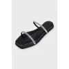 Leather flip-flops decorated with rhinestones