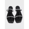 Leather flip-flops decorated with rhinestones