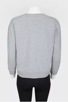 Gray sweatshirt with an embroidered donut