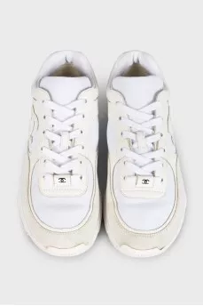 White logo-embossed sneakers