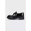 Black leather loafers with logo
