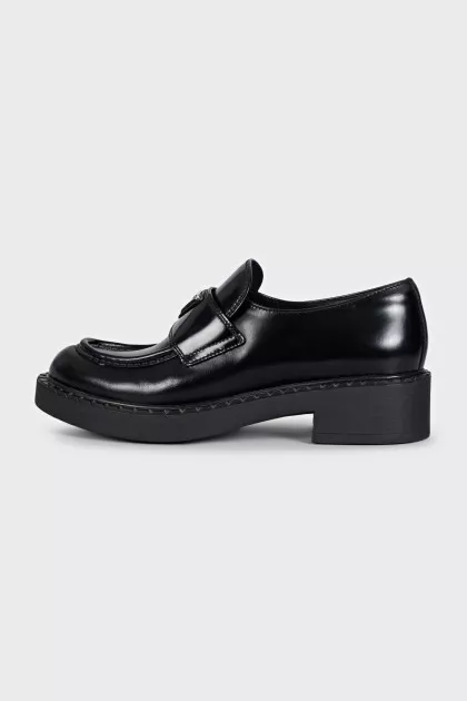 Black leather loafers with logo