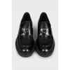 Black leather loafers with logo