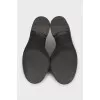 Black leather loafers with logo