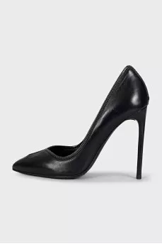 Black leather shoes decorated with a zipper