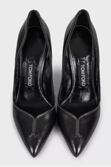 Black leather shoes decorated with a zipper