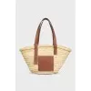 Beige raffia bag with a 3D leather logo
