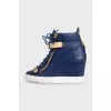 Leather wedge sneakers with embossed detailing
