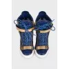 Leather wedge sneakers with embossed detailing