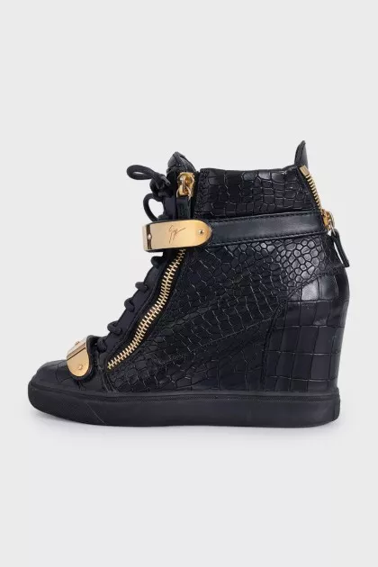 Black leather sneakers with gold hardware