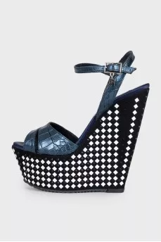 Sandals with a high decorated wedge heel