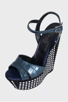 Sandals with a high decorated wedge heel