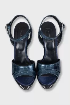 Sandals with a high decorated wedge heel