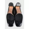 Black leather shoes with gold heels