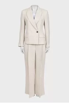 A suit consisting of a button-down jacket and trousers with a tag