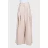 Beige wide-leg trousers with a high waist