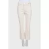 Straight-leg beige jeans with tag