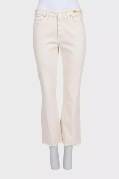 Straight-leg beige jeans with tag
