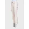 Straight-leg beige jeans with tag