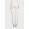 Straight-leg beige jeans with tag