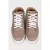 Brown leather sneakers with logo