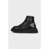 Black leather lace-up boots