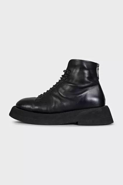 Black leather lace-up boots