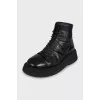 Black leather lace-up boots
