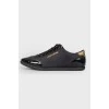 Black sneakers with varnish inserts