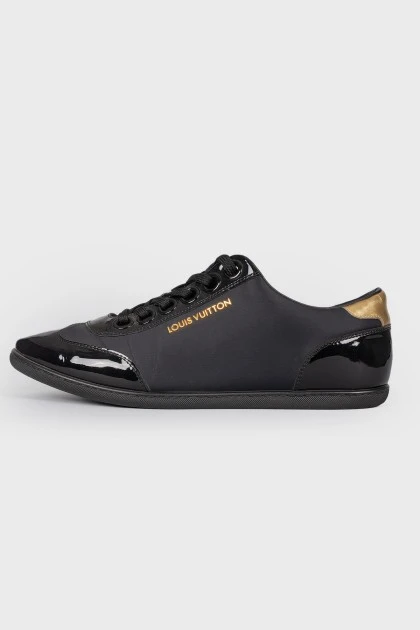 Black sneakers with varnish inserts