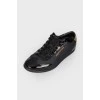 Black sneakers with varnish inserts