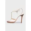 White leather sandals with decor