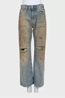Straight-leg blue jeans with a distressed effect