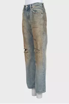 Straight-leg blue jeans with a distressed effect