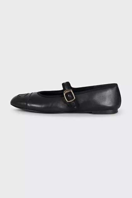 Black leather ballet flats with signature embroidery