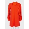 Orange dress with a decorative element