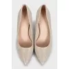Shiny silver pumps