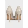 Shiny silver pumps
