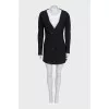 A suit consisting of a long jacket and a miniskirt