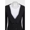 A suit consisting of a long jacket and a miniskirt