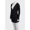A suit consisting of a long jacket and a miniskirt